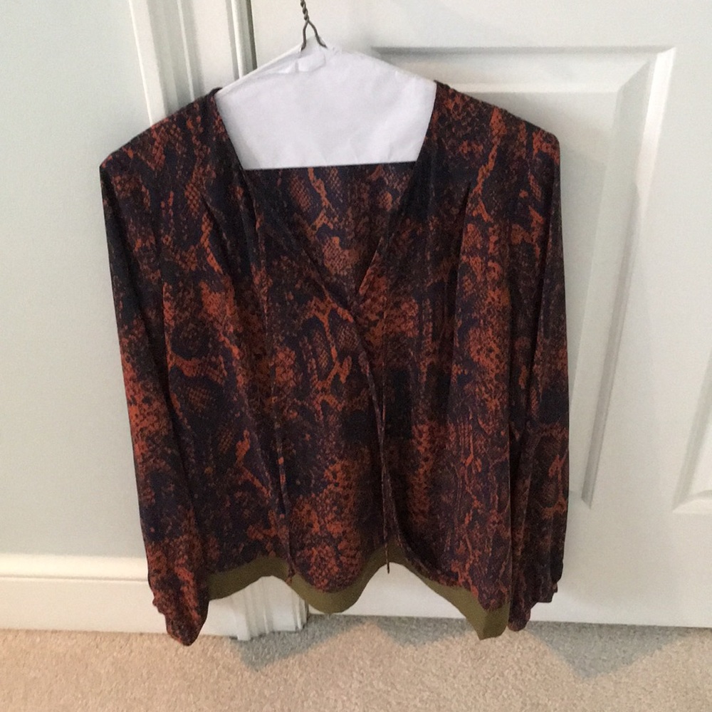 Cabi tan and blue wrap blouse with great detail.